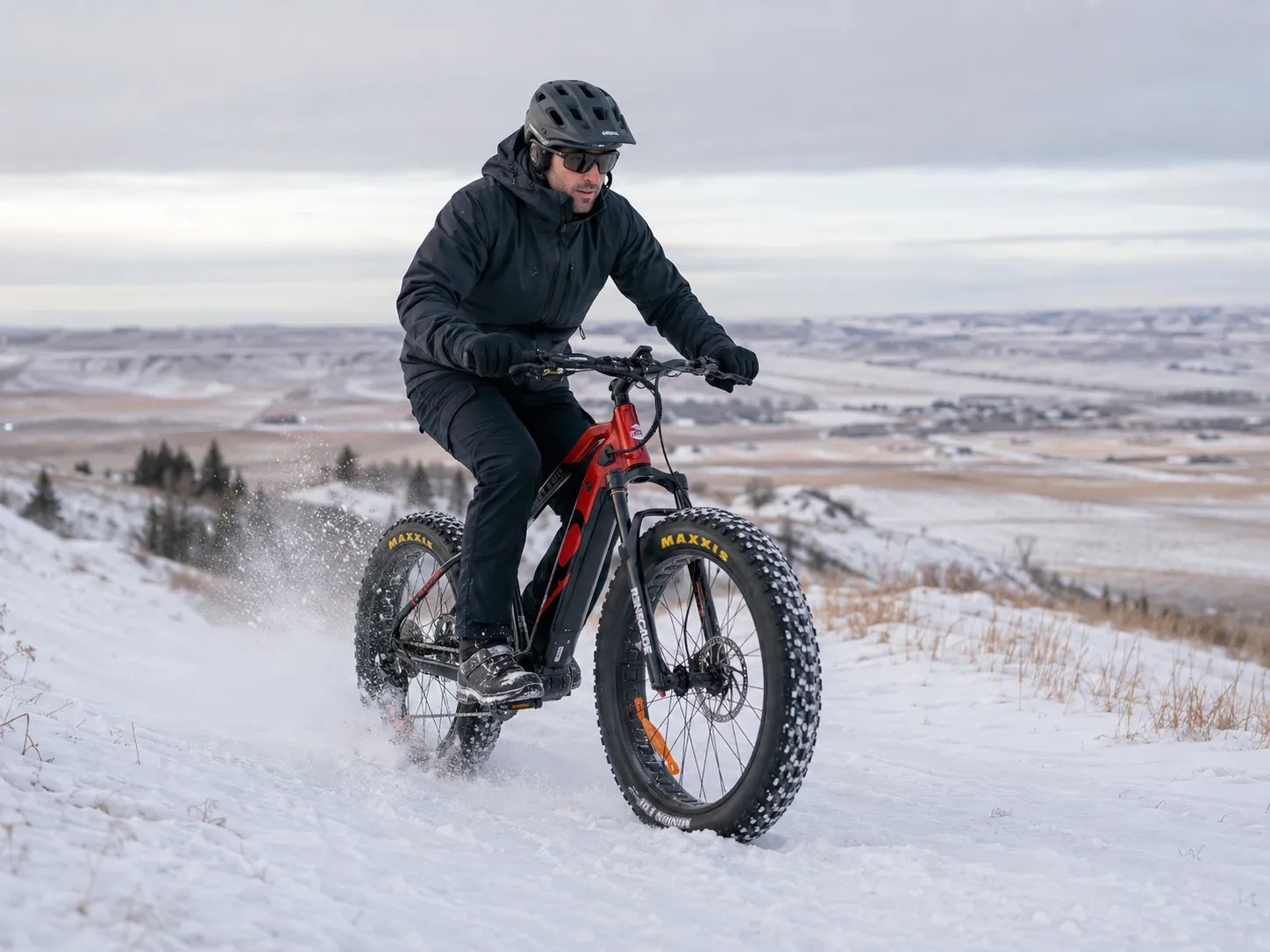 Rider on the iGO Torngat RS fat eBike carving through fresh snow above the prairie