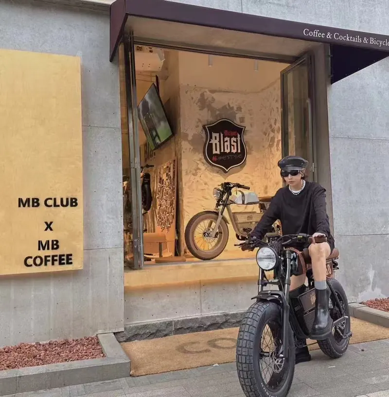 Rider parked outside a café with an Outsider 5.0