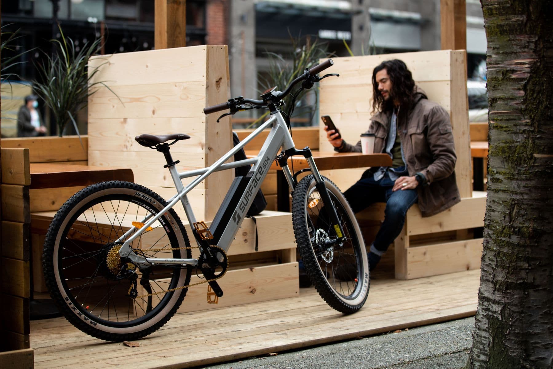 Surface 604 commuter parked at a downtown cafe patio